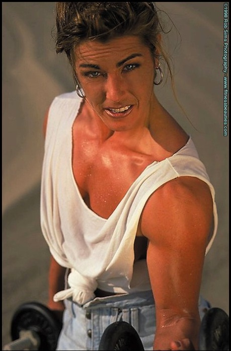 Brunette bodybuilder Kelly Oreilly flexes outdoors in various outfits 58060972