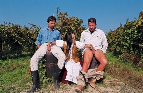Costumed wench gives a double handjob in the yard to alehouse visitors 11350630